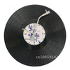 A black decorative vinyl record wall clock with a white face and Chinese characters.