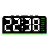 Reloj de alarma digital LED negro mostrando la hora 22:38 con luz de fondo verde.