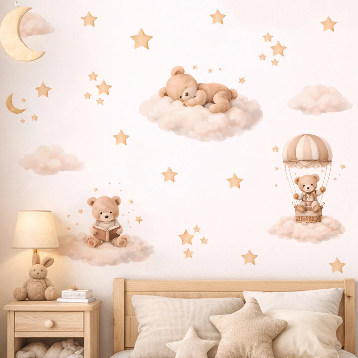 Wall stickers featuring cartoon bears, stars, and clouds decorating a bedroom wall.
