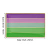 A rectangular lapel pin featuring five horizontal stripes of purple, green, and pink colors.