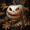 A carved white pumpkin face with glowing orange eyes and a wide, menacing grin surrounded by autumn leaves.