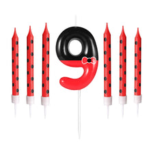 A set of nine birthday candles shaped like the number 9 featuring a red and black mouse design.