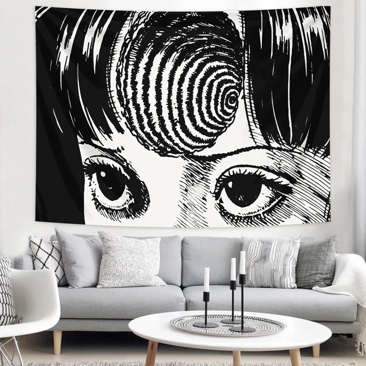 Black and white tapestry featuring a stylized human eye and facial features.