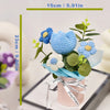 A handmade crochet tulip bouquet featuring blue and white flowers in a pink vase for home decor.