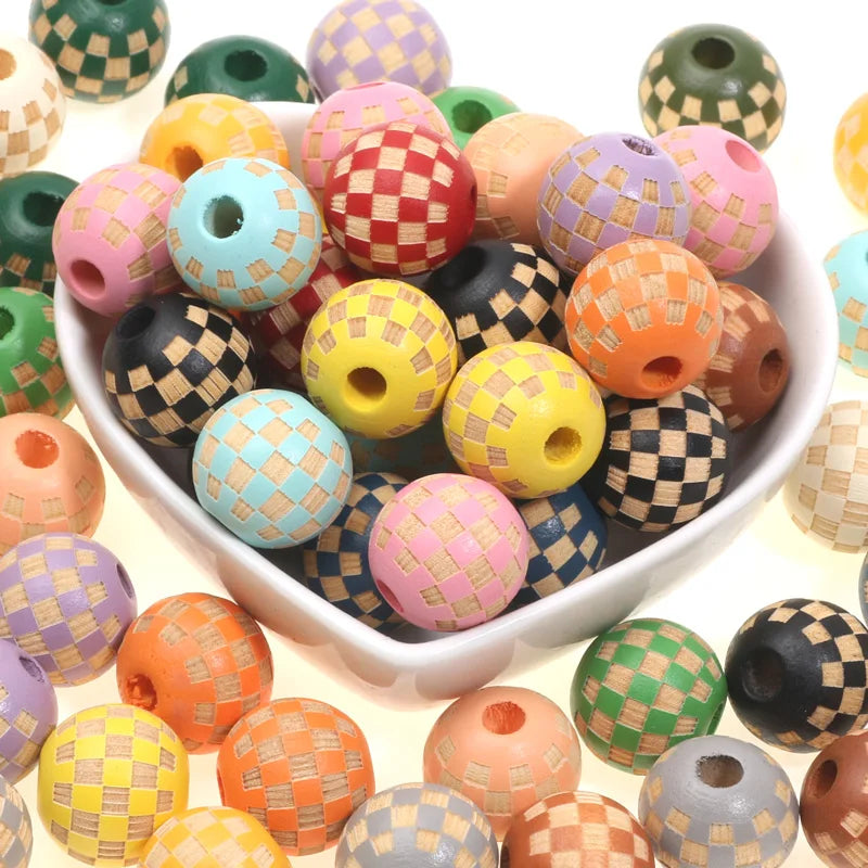 A collection of natural wooden checkered beads in various colors including pink, yellow, green, and brown.