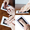 Hands print and foot print on a white pad for baby keepsake