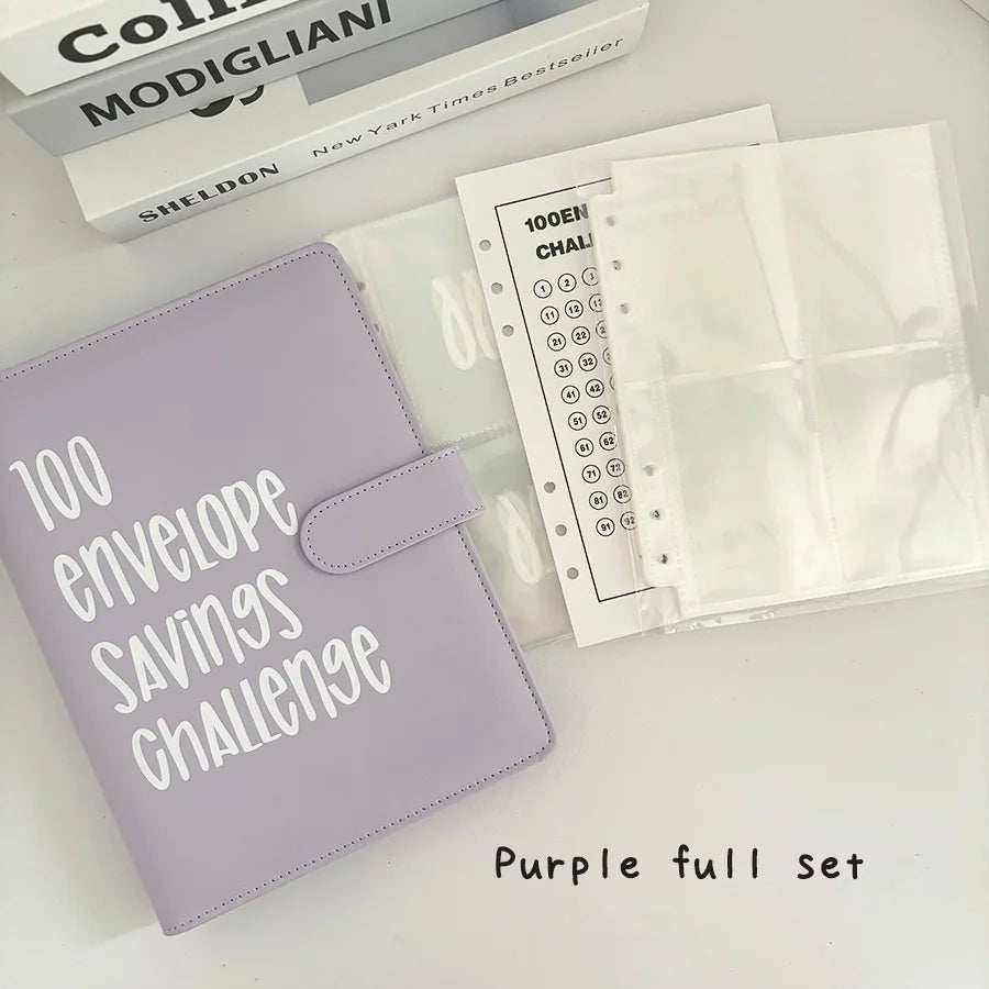 Purple full set of an A5 100-envelope savings challenge binder with numbered pockets and related books