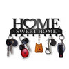Black metal key holder with hooks featuring a cat silhouette and the text Sweet Home