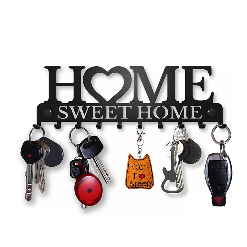 Black metal key holder with hooks featuring a cat silhouette and the text Sweet Home