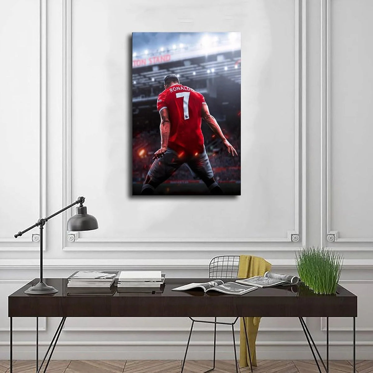 A canvas wall art poster featuring Cristiano Ronaldo in a red jersey, looking determined on a football field.
