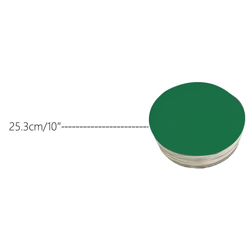 A stack of round, dark green cardboard cake boards, with a dimension line indicating 25.3 cm or 10 inches.