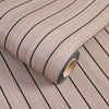Roll of self-adhesive 3D wood grain wall panels showing vertical wood texture and dark edge.
