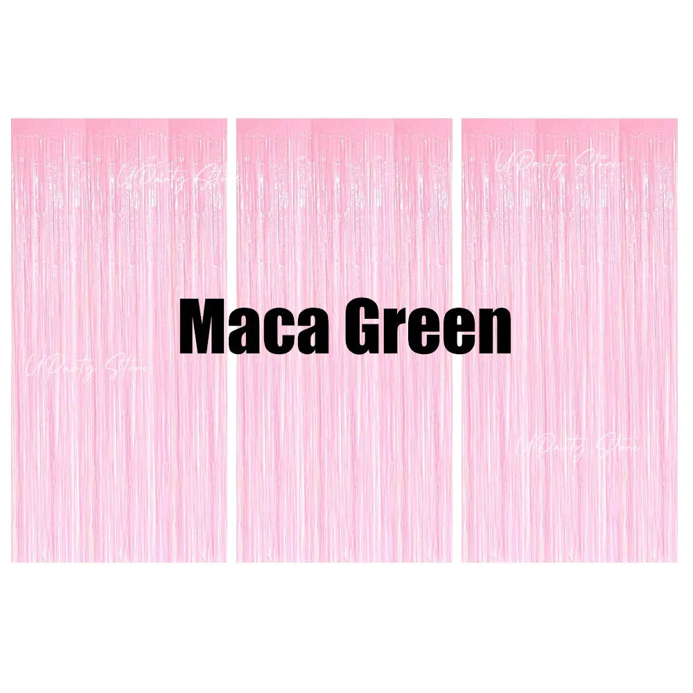 Pink metallic foil fringe curtains with the text Maca Green displayed on a light pink background.
