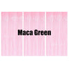 Three vertical panels of pink metallic foil fringe curtains with the text Maca Green displayed on them.