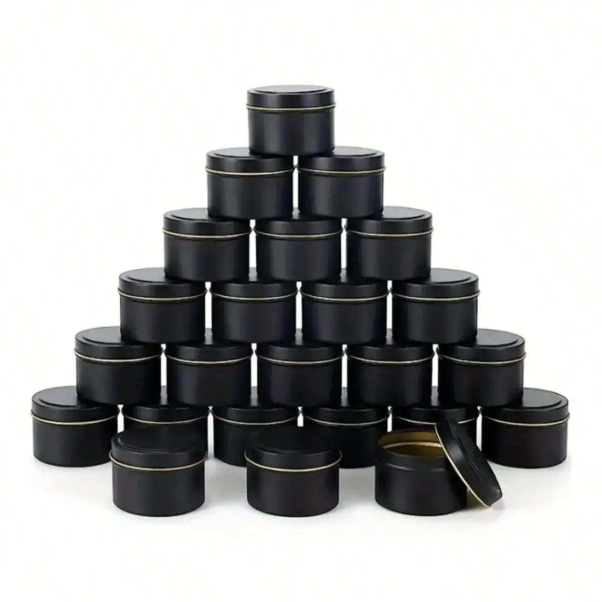 A stack of black metal candle tins with lids arranged in a pyramid formation.