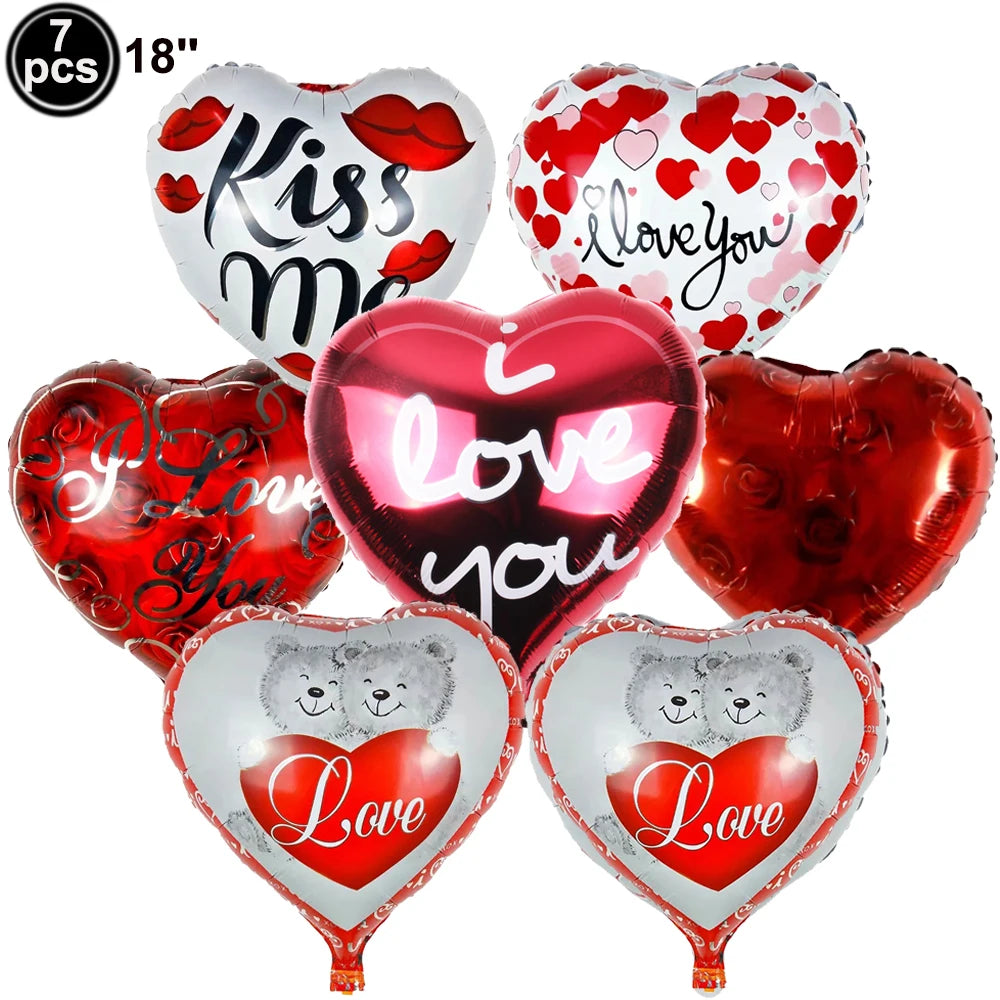 Seven heart-shaped balloons in various colors including red and silver with 'I love you' or 'love' text
