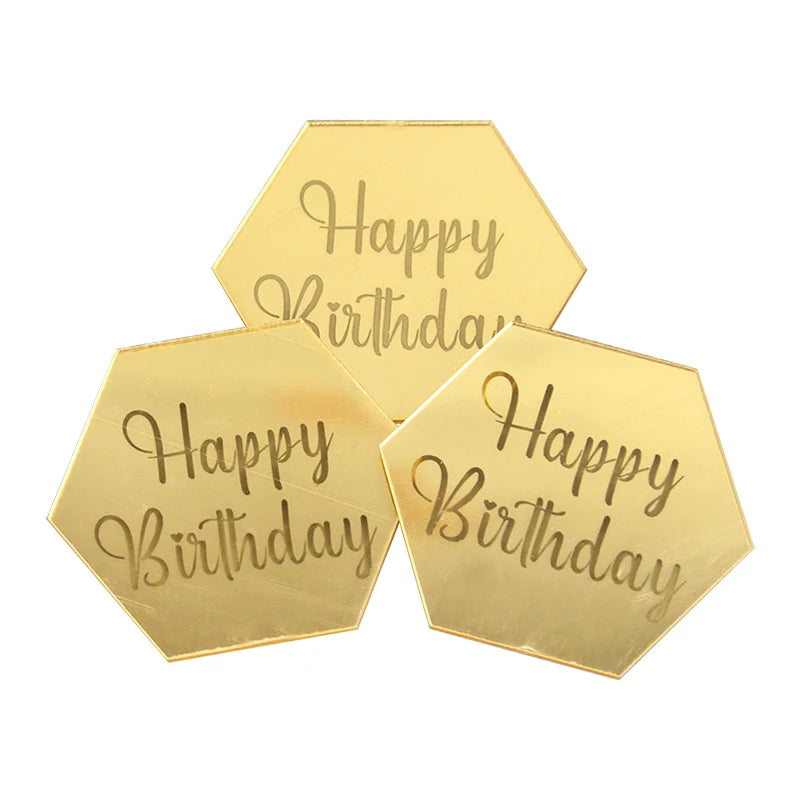 A set of ten gold hexagonal acrylic birthday toppers with the text Happy Birthday