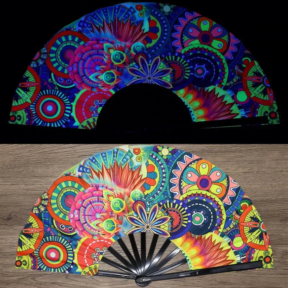 A folding rave hand fan featuring vibrant fluorescent UV glow patterns in pink, blue, green, and yellow.