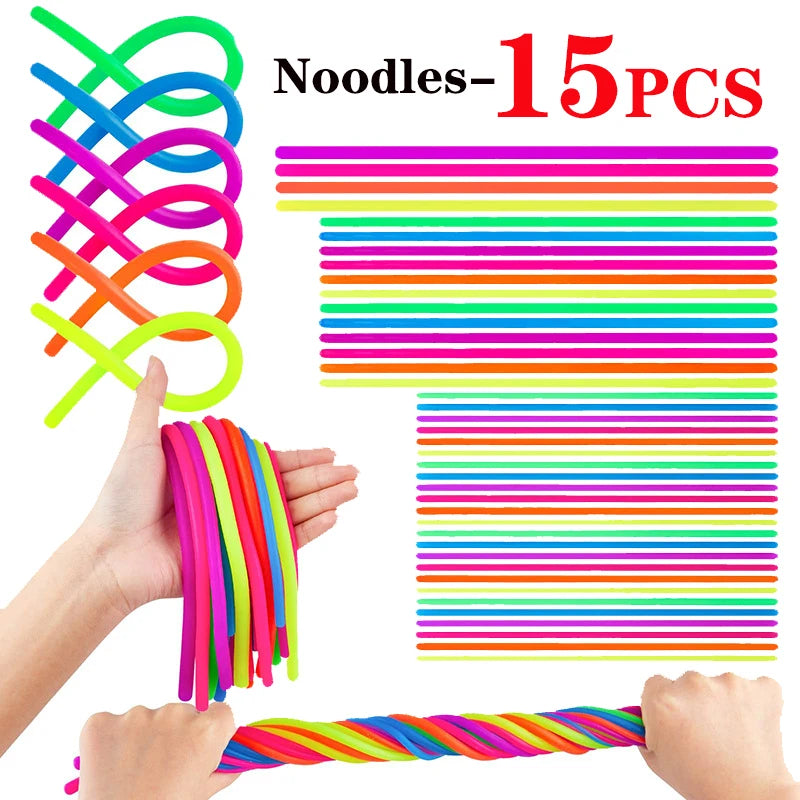 A hand is holding a bundle of colorful, stretchy noodles and another hand is holding a single noodle.
