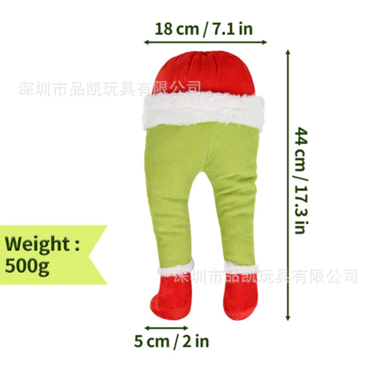 Green monster Christmas wall decor in a gift bag with red and white trim