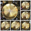 A set of stainless steel pentagram altar plates displayed on a dark surface with astrological and ritualistic markings.