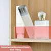 Clear acrylic shelf divider holding a glass bottle and a pink cosmetic product on a wooden shelf.