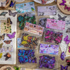 A collection of butterfly art collage stickers and embellishments for scrapbooking