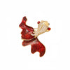 A vintage marine life brooch pin set featuring a red and gold design with sparkling accents.