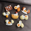A set of kawaii food-themed fridge magnets featuring various shapes like donuts, eggs, and a duck.