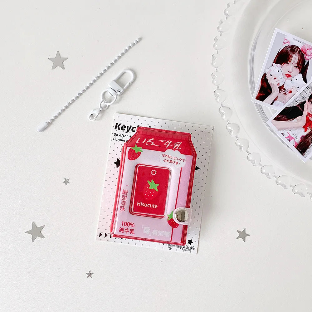 A red cartoon milk bottle photo keychain with a silver clasp and a decorative card on a white background.