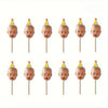 A set of ten personalized baby photo cupcake toppers featuring infants' faces on yellow and white conical picks.