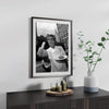 Framed black and white photograph of Anthony Bourdain making a peace sign