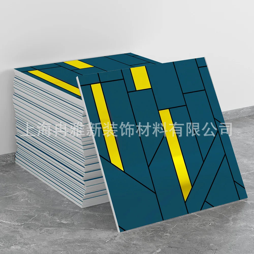 A stack of blue and yellow marble peel-and-stick tile stickers is displayed on a gray surface.