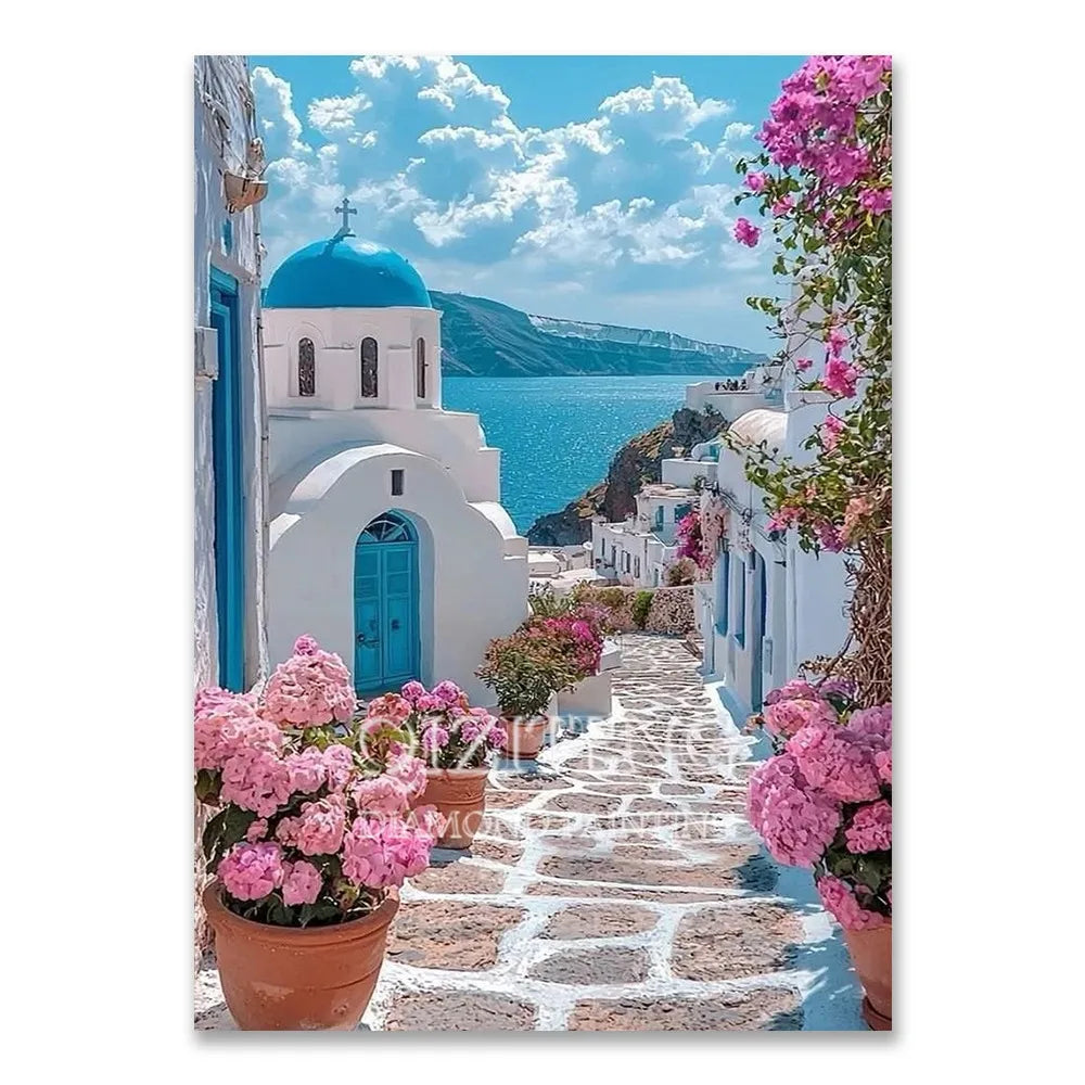 A narrow stone pathway lined with white buildings and vibrant pink bougainvillea flowers under a blue sky.