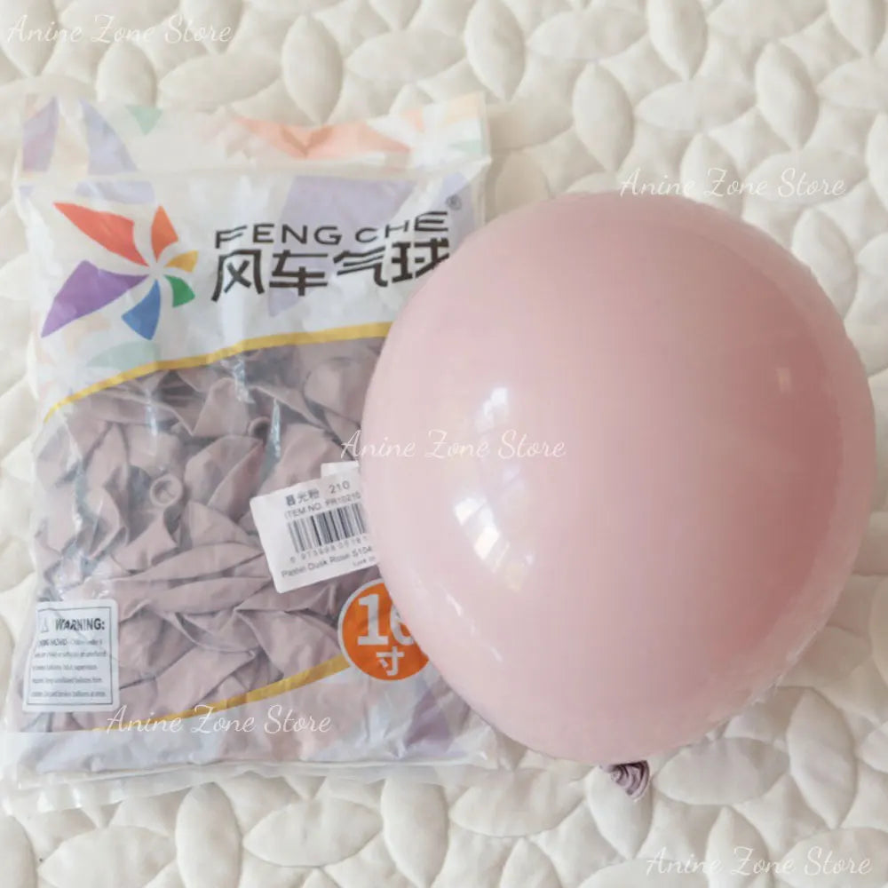 A package of pastel pink latex balloons for party decorations is shown on a white surface.