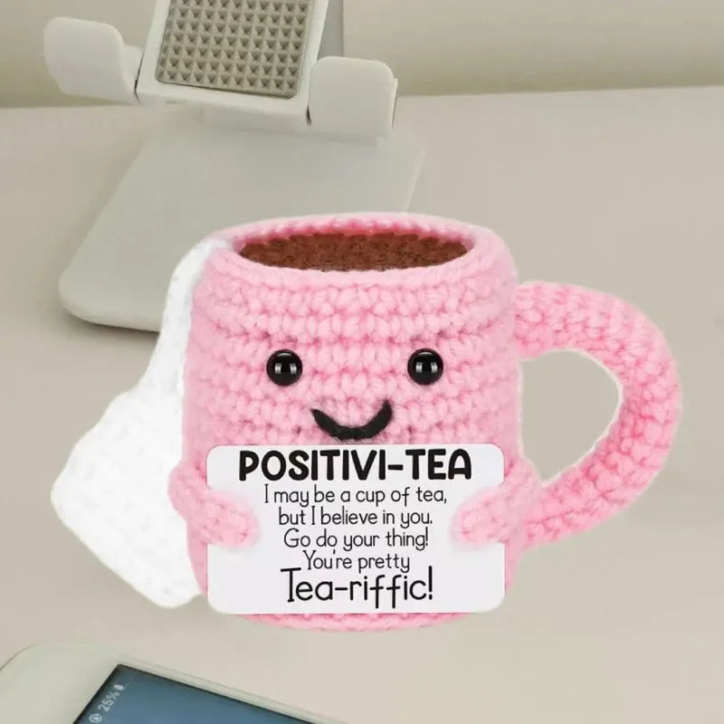 Pink handmade crochet tea cup ornament with a motivational message inside