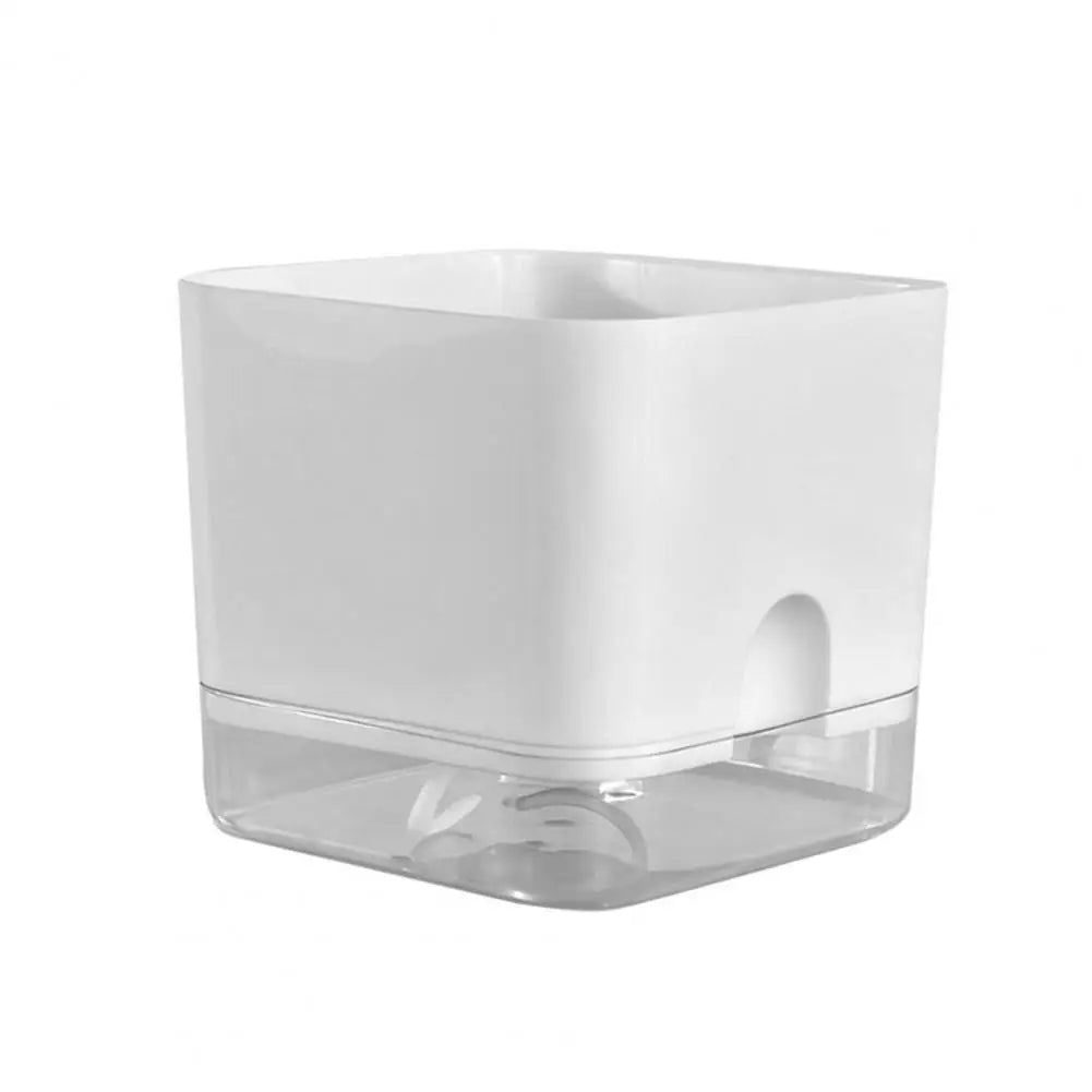 A white self-watering planter with a clear reservoir base.
