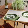 A canvas print set featuring a sage green cheetah and pool ball design displayed on a wooden table.
