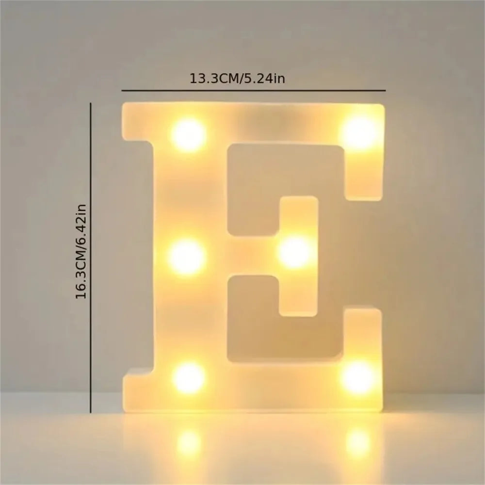 A glowing yellow LED letter E sign made of translucent acrylic for room or party decor.