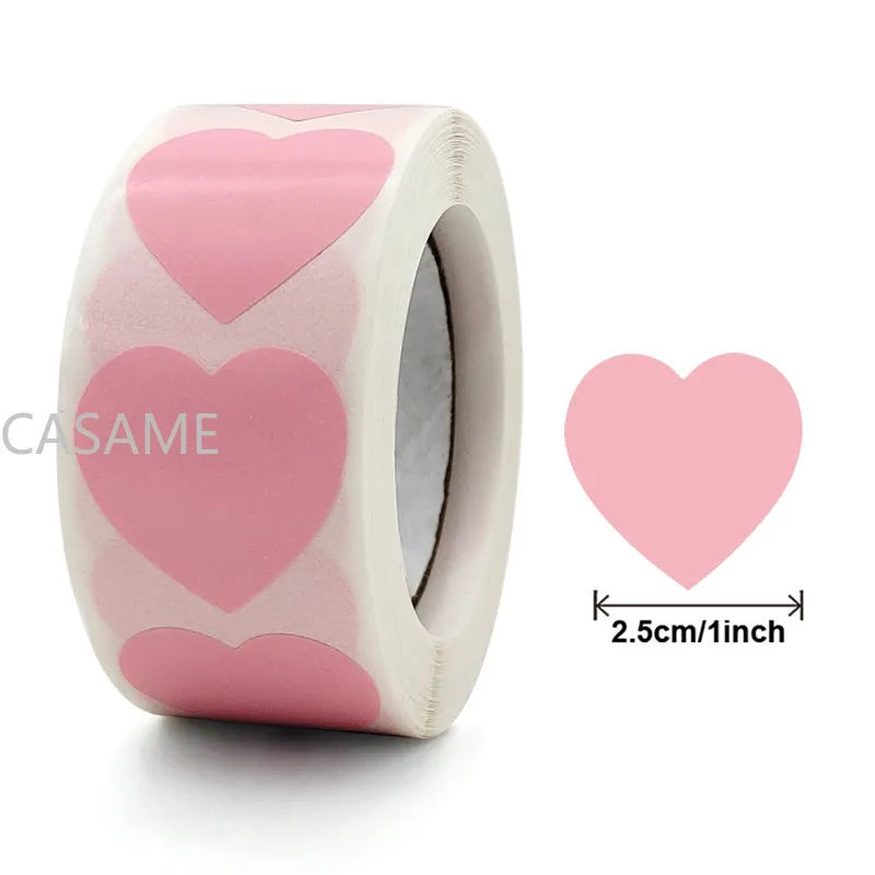 Roll of pink heart-shaped seal stickers for crafting and packaging