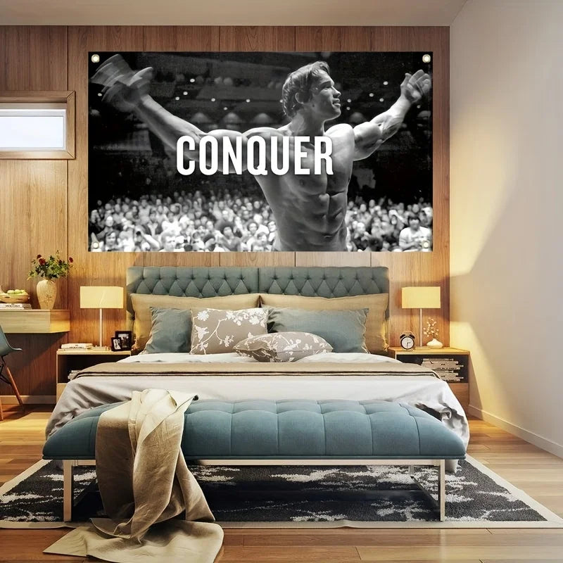 A motivational gym flag featuring Arnold Schwarzenegger hanging banner displayed above a modern bed.