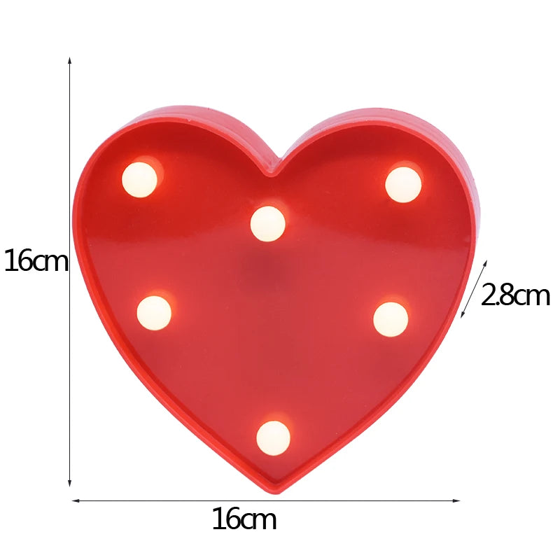 A red heart-shaped LED light featuring multiple warm white lights.