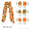 Artificial vine featuring orange and green maple leaves used for autumn decor