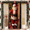 A festive Christmas Santa figure is visible through a decorated door frame with evergreen garlands.