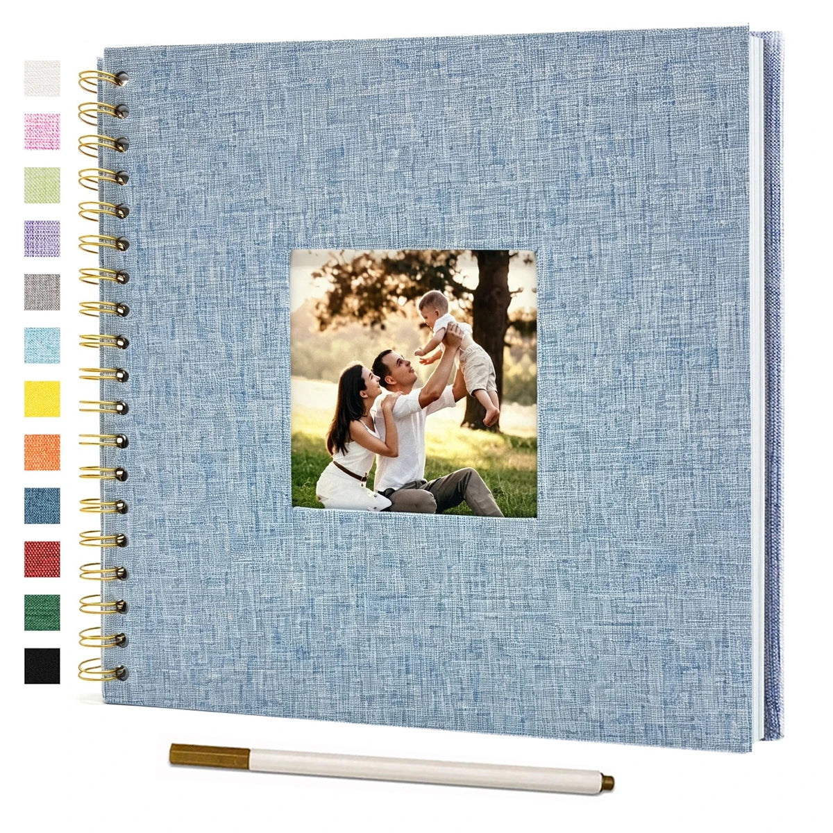 A blue linen cover scrapbook album with a photo of a couple embracing in a park.