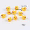 A collection of 50 yellow mini resin duck figurines used for crafts and decor.