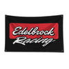 Black flag with red text 'Edelbrock Racing' on the front