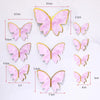 Set of pink and gold butterfly cake toppers for parties and baking