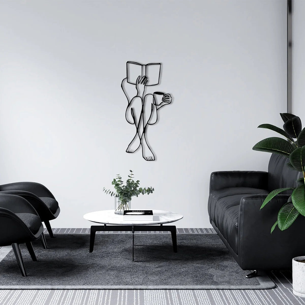 Black line art wall decor featuring two figures holding an open book on a white round table in a modern living space.