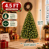 A fully decorated 4.5 FT Fraser Fir artificial Christmas tree with warm white and multicolor LED lights standing in a room.